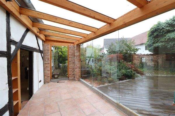 Kleiner Wintergarten an Terrasse