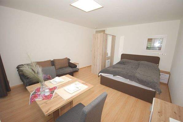 Wohnzimmer mit Schlafnische