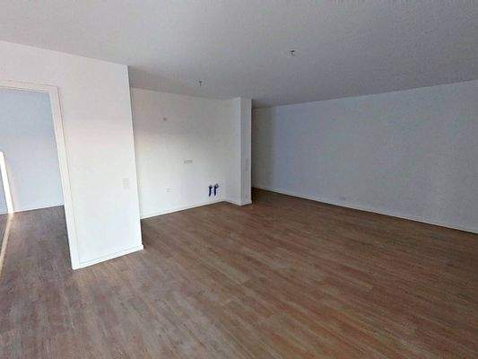 Ansicht III: Wohnzimmer und Essbereich mit offener Küche