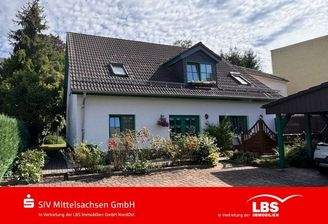 Ansicht mit gepflasterten Stellflächen