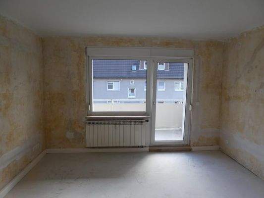 Wohnzimmer mit Balkon