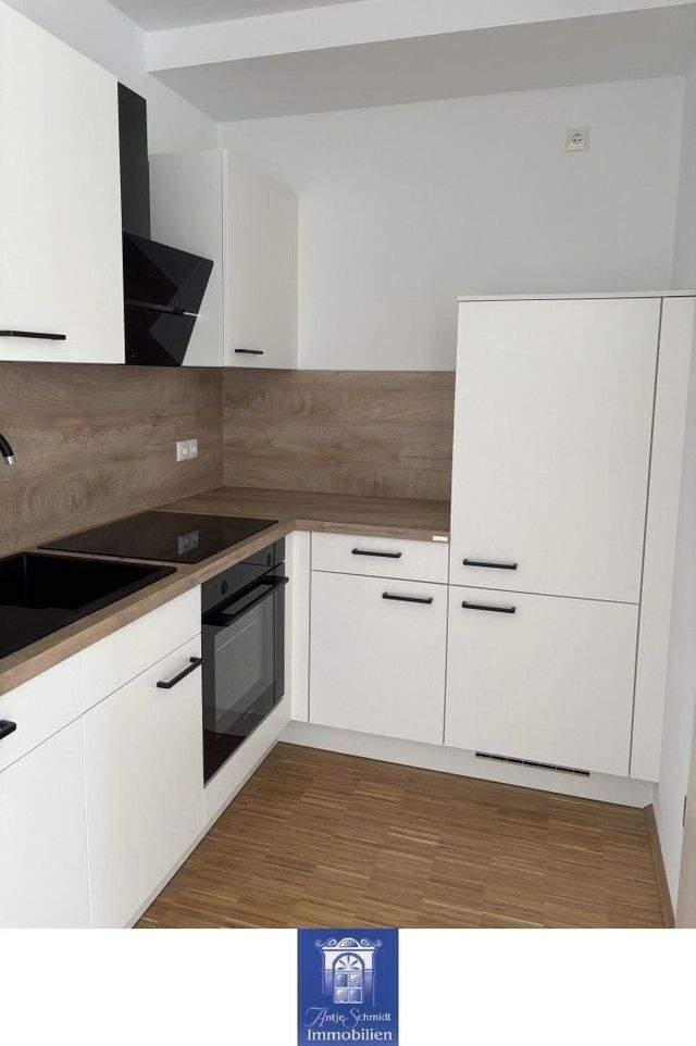 Gemütliche und hochwertige Neubauwohnung mit Balkon, EBK und Fußbodenheizung! - Foto 3