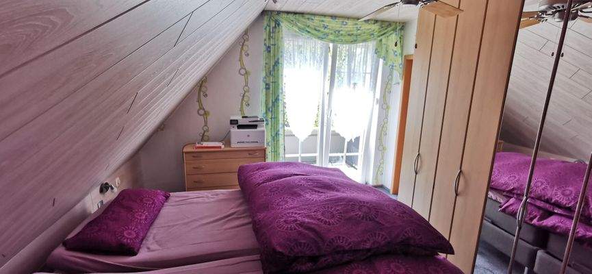 Schlafzimmer mit Balkon