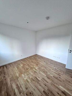 Schlafzimmer mit Holzboden