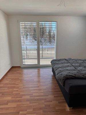 Schlafzimmer mit Zugang zur Terrasse