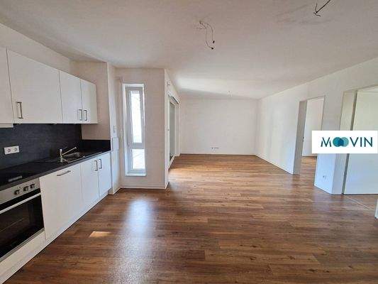 Ansicht II: Wohn- und Esszimmer mit offenem Küchenbereich