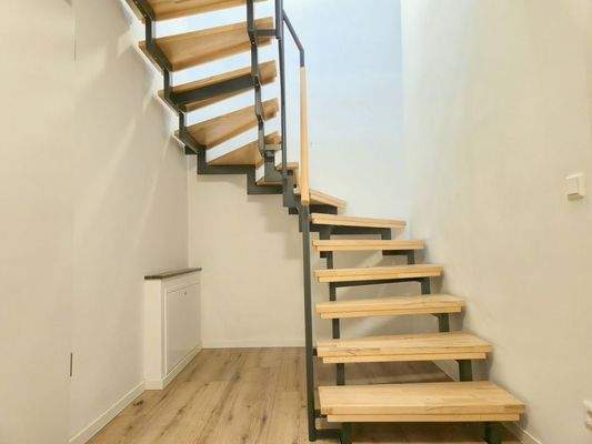 Stairs from the upper floor to the ground floor