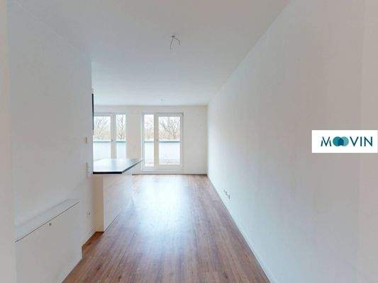 Ansicht V: Wohn- und Esszimmer mit offenem Küchenbereich