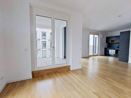 Ansicht I: Wohn- und Esszimmer mit offenem Küchenbereich