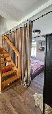 Cozy Bedroom with Staircase