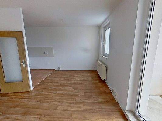 Ansicht III: Wohn- und Esszimmer mit offenem Küchenbereich