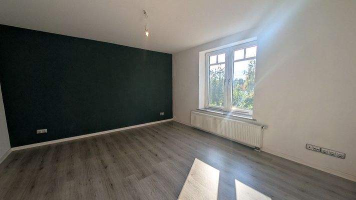 Wohnzimmer in Wohnung 3 im DG