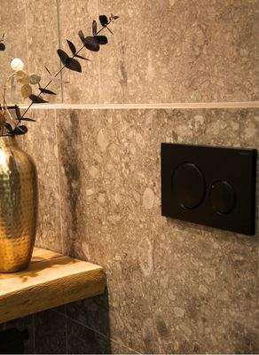 Gäste-WC mit stilvoller Gestaltung und hochwertigen Sanitärelementen