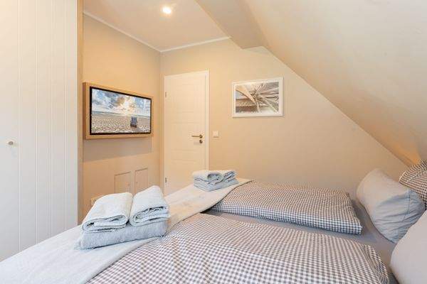 Das gemütliche Schlafzimmer mit Fernseher