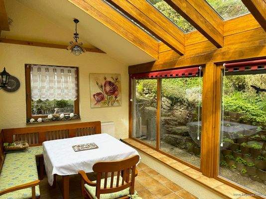 Im gemütlichen Wintergarten können Sie entspannen