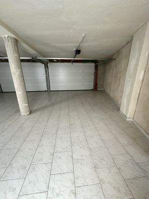 KomfortableEinzelgarage mit hochwertiger Sektionaltor-Technik 