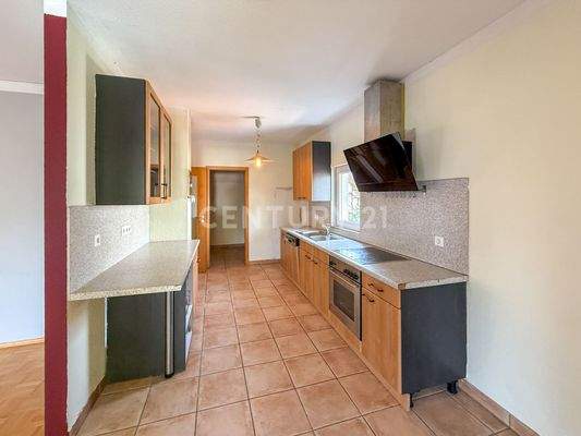 Die Einbauküche mit anschließender Speisekammer