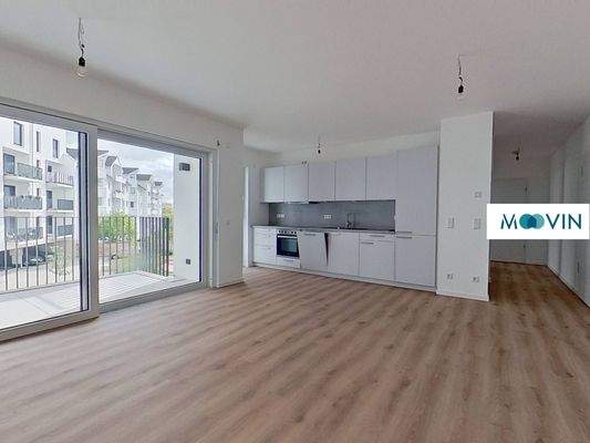 Ansicht III: Wohn- und Esszimmer mit offenem Küchenbereich