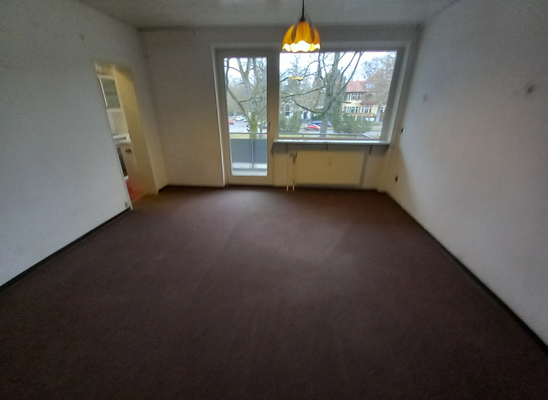 Wohnzimmer mit Balkon