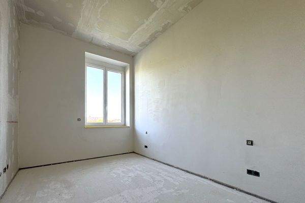 Schlafzimmer mit Ankleideecke