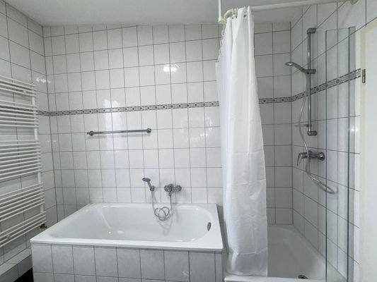 Bathroom with shower and bathtub