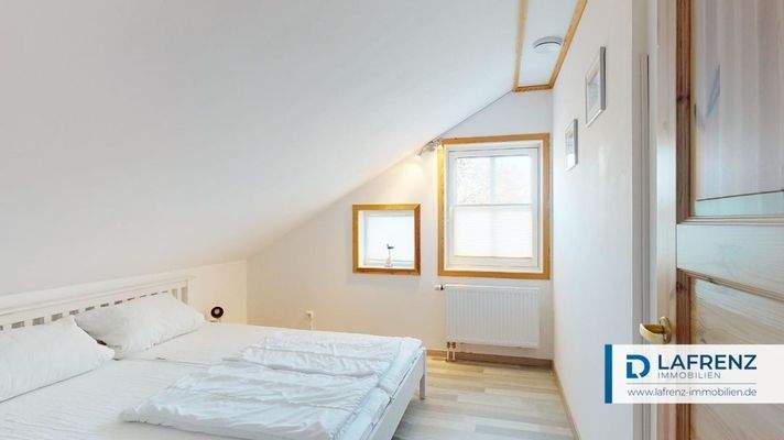 Wohnung im Dachgeschoss Schlafzimmer