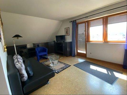 Wohnzimmer mit Balkon