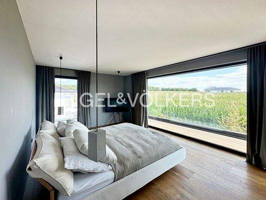 Schlafzimmer mit Ankleide und Bad en Suite