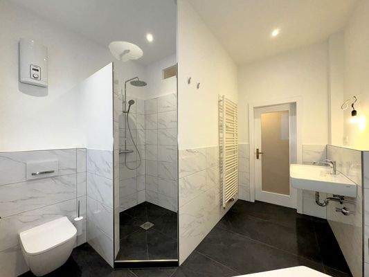 Bathroom with shower and bathtub