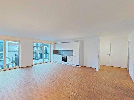 Ansicht II: Wohn- und Esszimmer mit offenem Küchenbereich