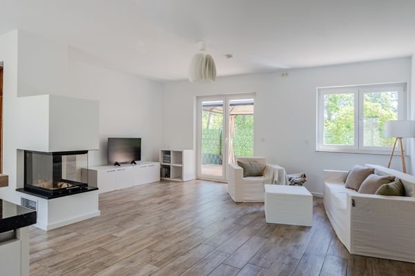 Large living/ dining and kitchen area with firepla