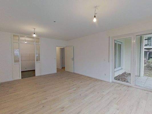 Ansicht III: Wohn- und Esszimmer mit offenem Küchenbereich