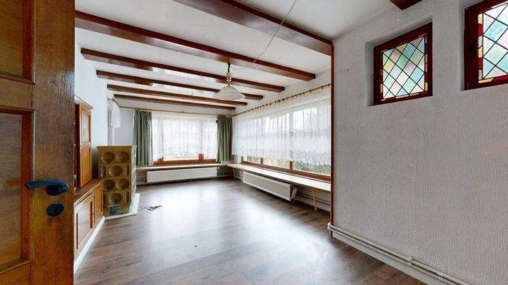 Wintergarten mit Kachelofen 