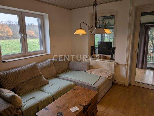 Wohnzimmer mit Zugang zum Wintergarten