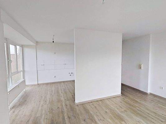 Ansicht IV: Wohn- und Esszimmer mit offenem Küchenbereich