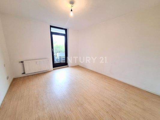 Schlafzimmer mit Zugang zum Balkon