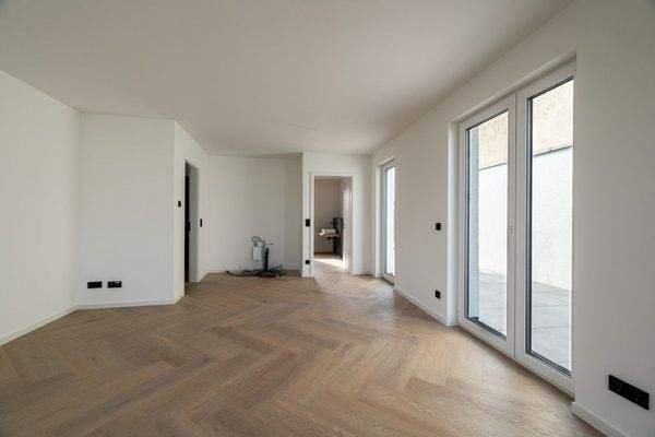 Wohnzimmer mit offener Küche