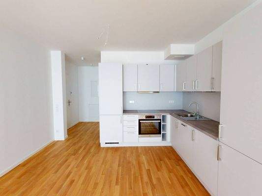 Ansicht IV: Wohn- und Esszimmer mit offenem Küchenbereich