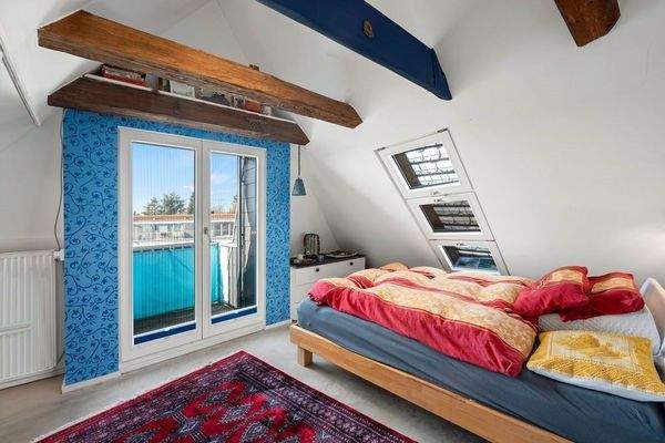 Schlafzimmer mit Balkon