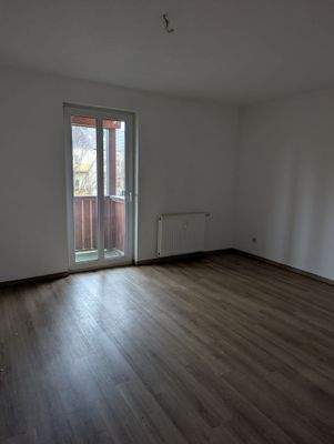 Schlafzimmer mit Zugang zum Balkon