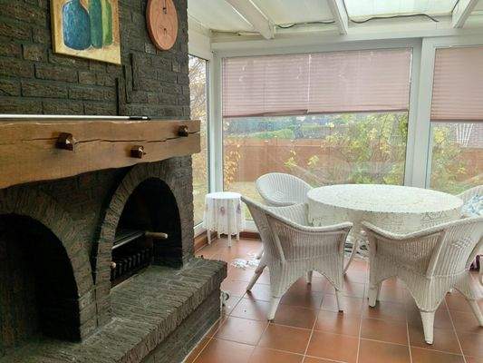 Wintergarten mit Kamin