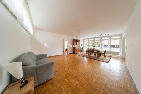 Spacious living room with large window front 