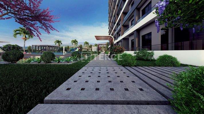 New Apartments in Mersin with a Pool and Modern Landscaping