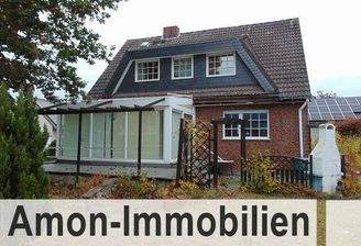 Haus mit Wintergarten und Terrasse.jpg