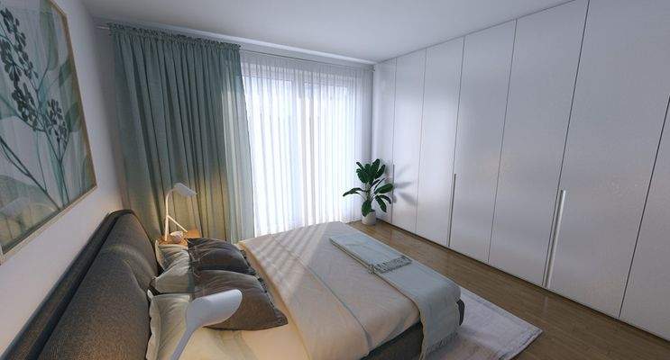 gemütliche-und-helle-Schlafzimmer-mit-Blick-ins-Grün