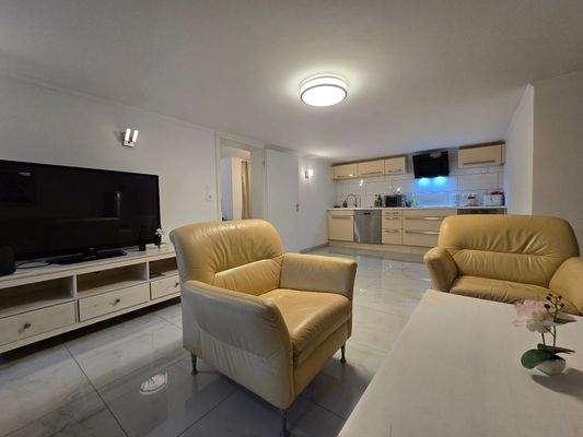 UG Maison Immobilien Bungalow Buchholz Wohnzimmer mit offener Küche