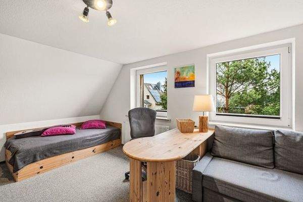 eines der Zimmer im DG