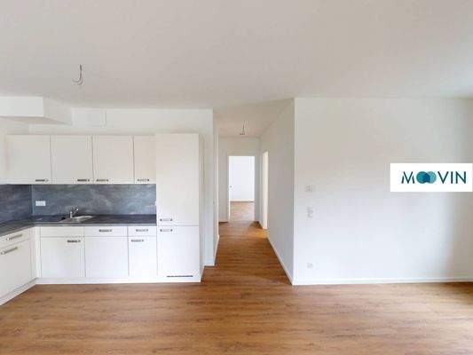 Ansicht V: Wohn- und Esszimmer mit offenem Küchenbereich