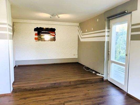 Wohnzimmer mit Zugang zur Terrasse