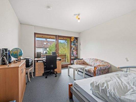 Schlafzimmer mit Balkonzugang